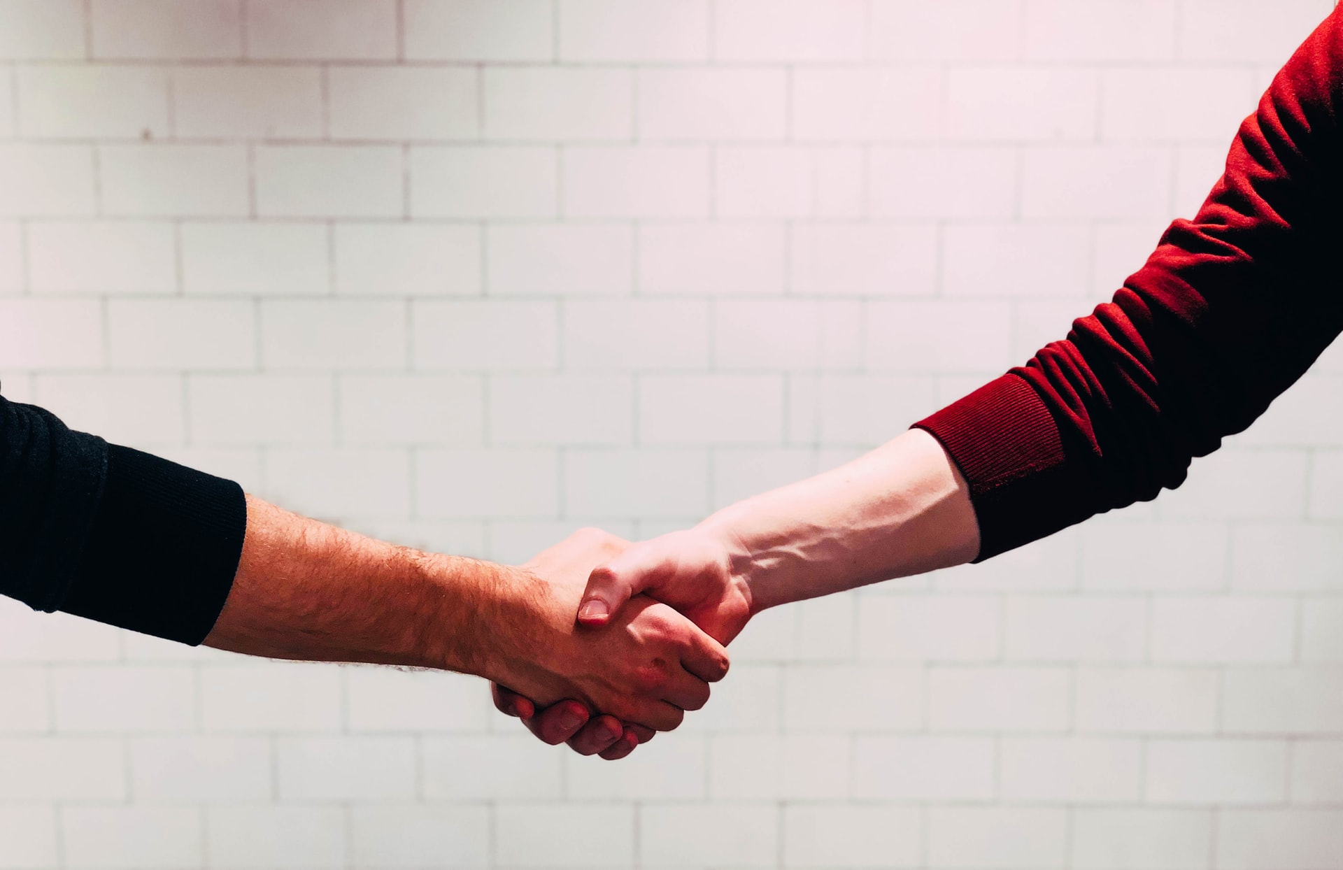 handshake between a business owner and a customer
