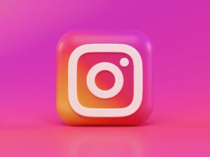 instagram logo in 3D form against a pink background