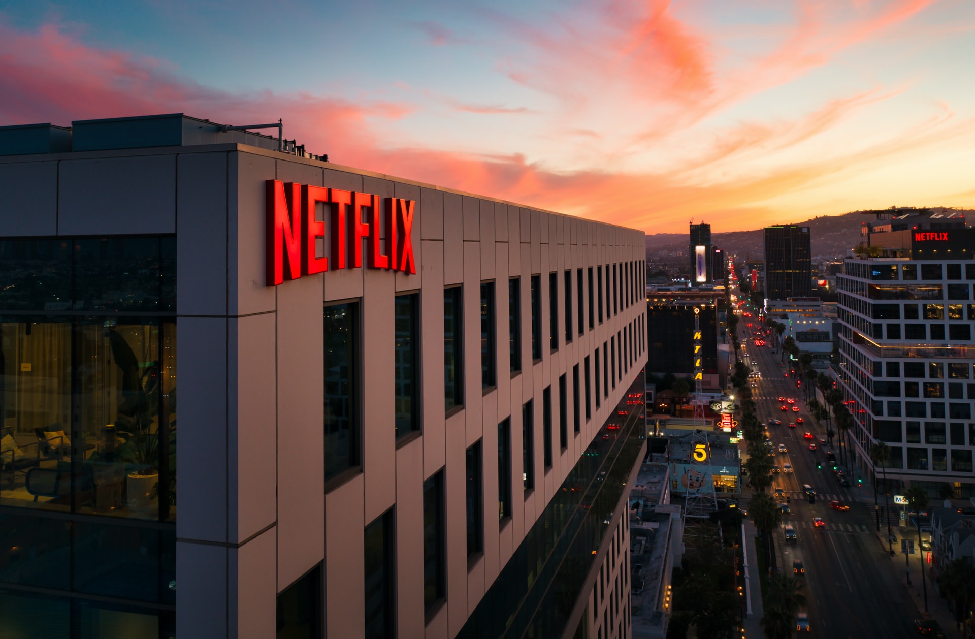 Netflix sign on a building at sunset