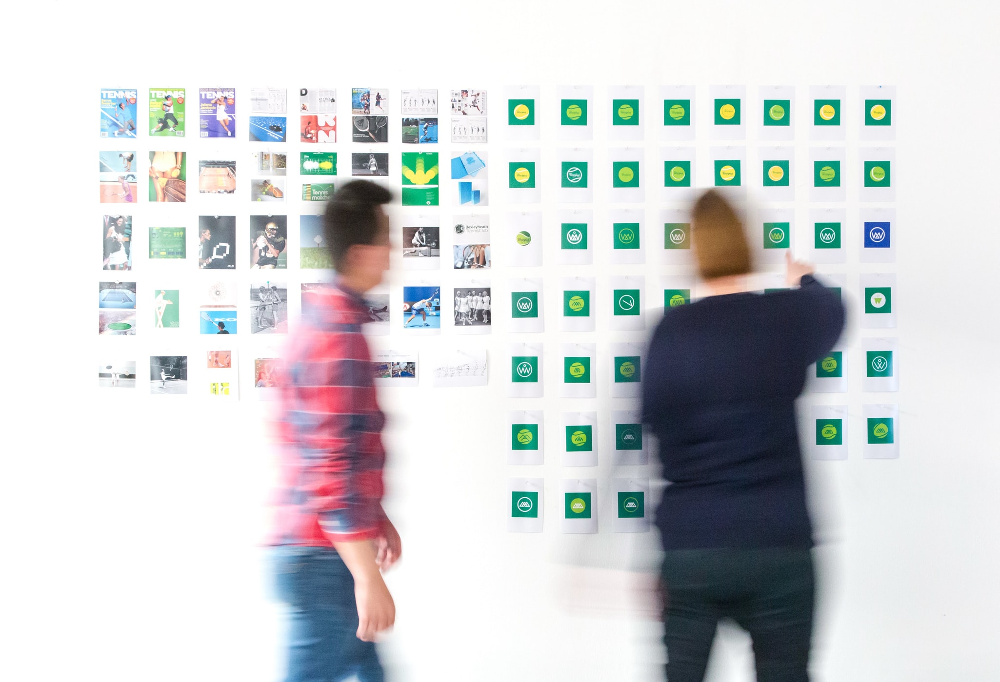 a pair of creatives planning for competitive content analysis