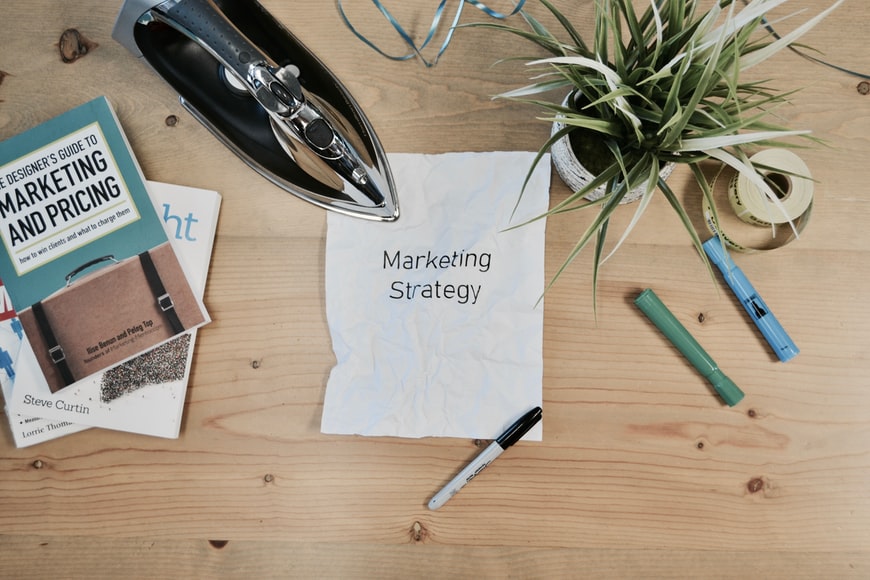 a Marketing Strategy phrase written on the paper
