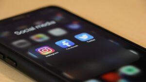 a mobile phone showing different social media platforms