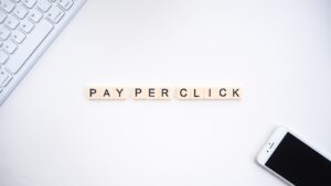 scrabble tiles laid out on a table spelling pay-per-click